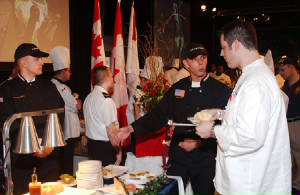cheftimwithjudgedescribingdishes.jpg